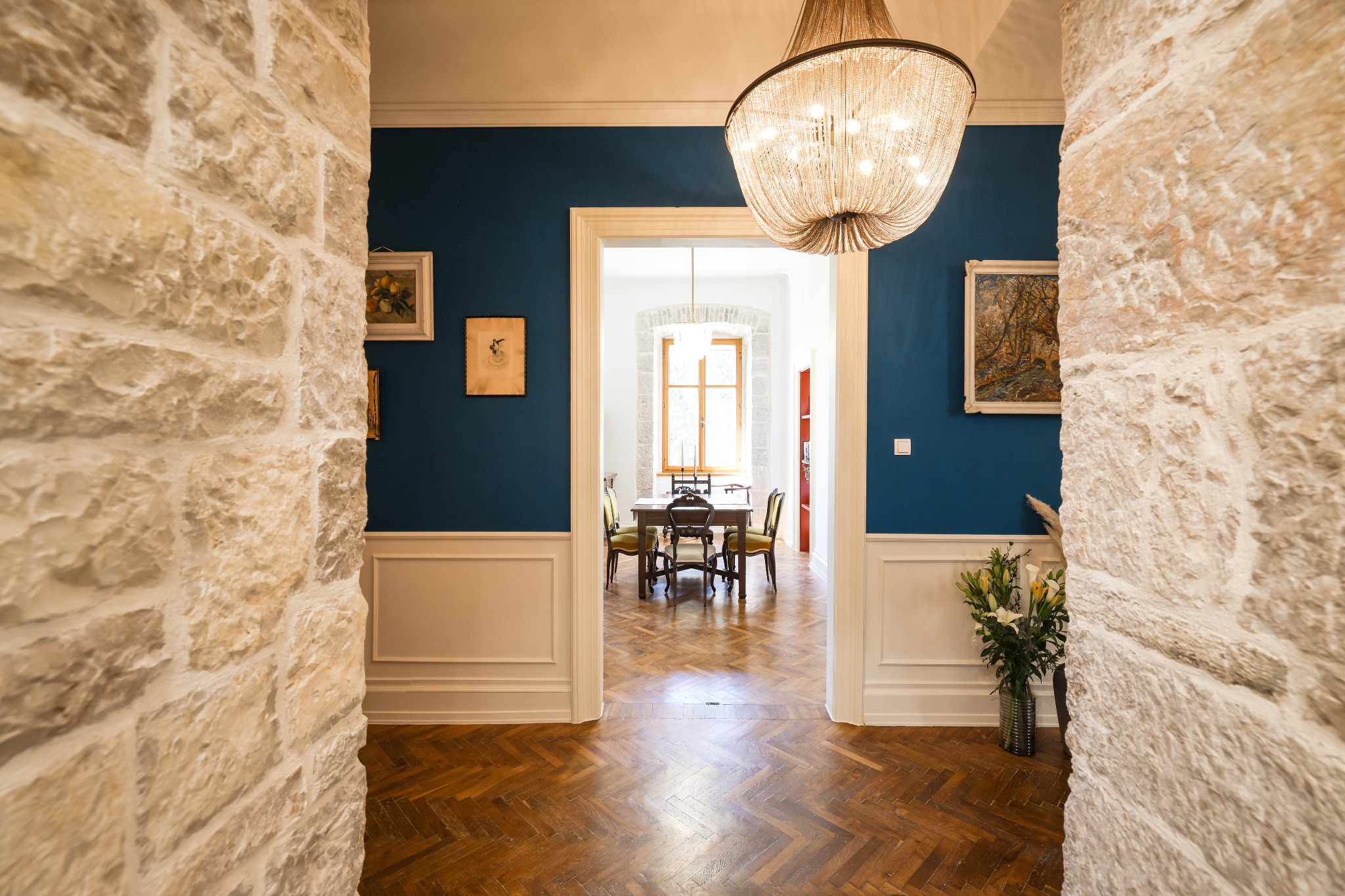 Historic stone walls framing the dining room at Historic Luxe