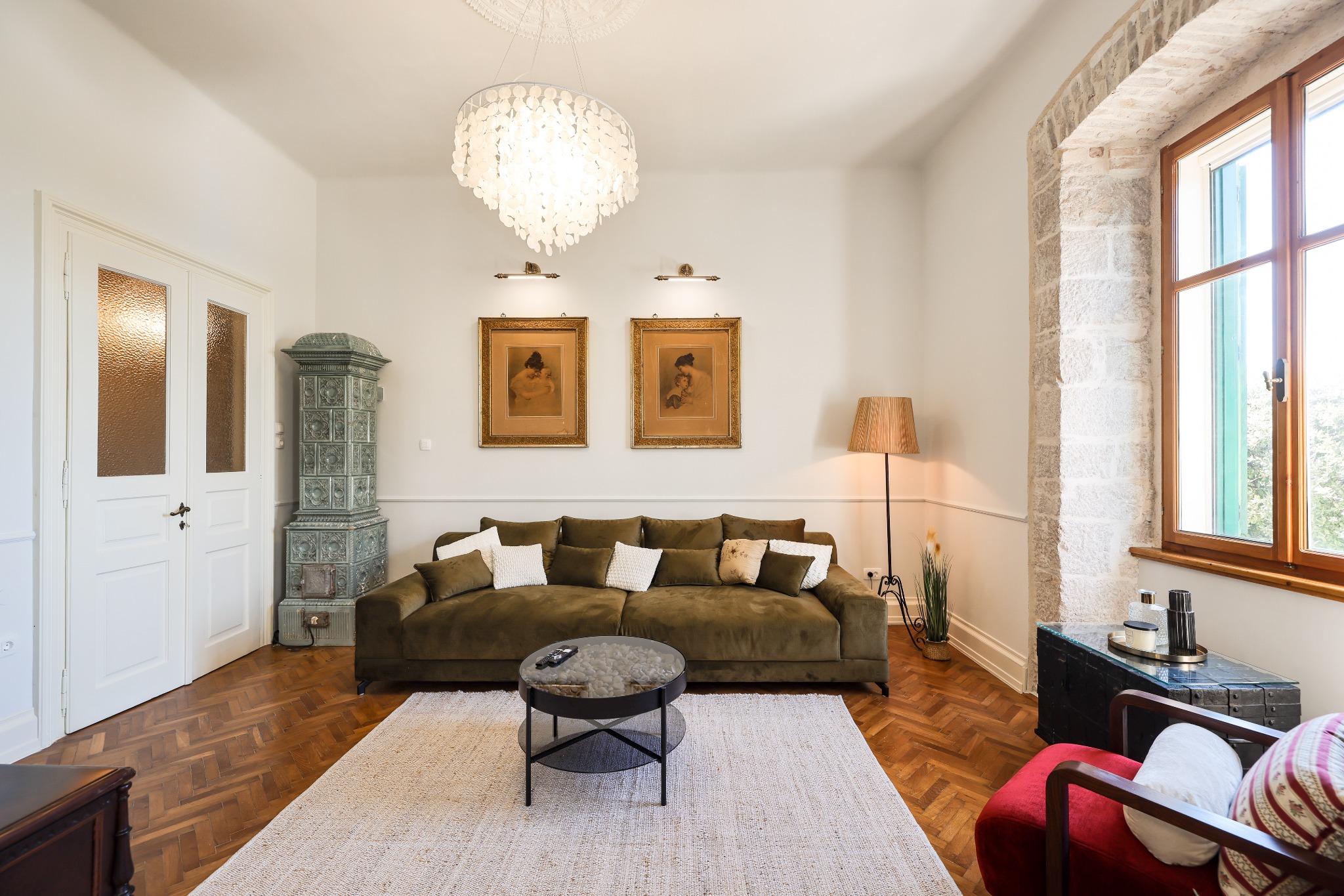 Living room framed by a historic stone arch